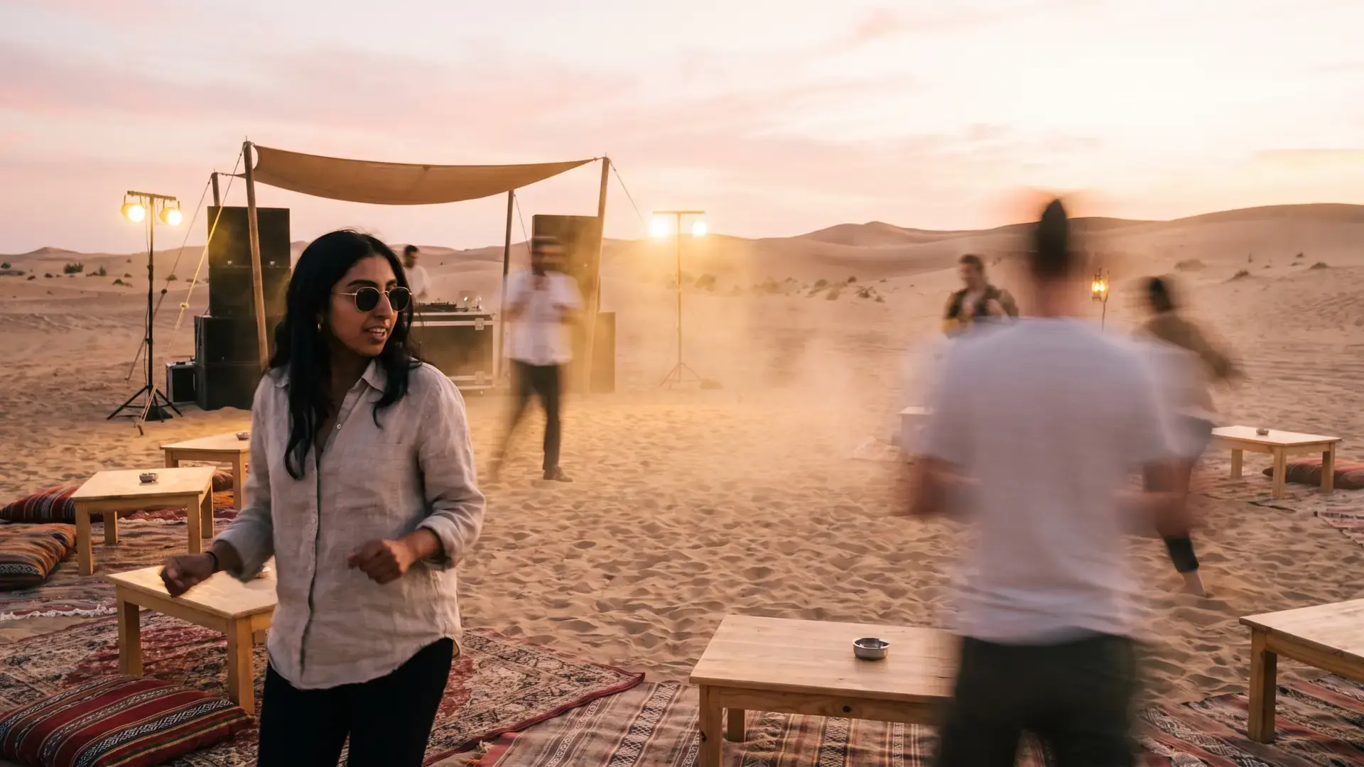 A desert party at dusk on beige sand under a shade canopy: the progressive house label directory