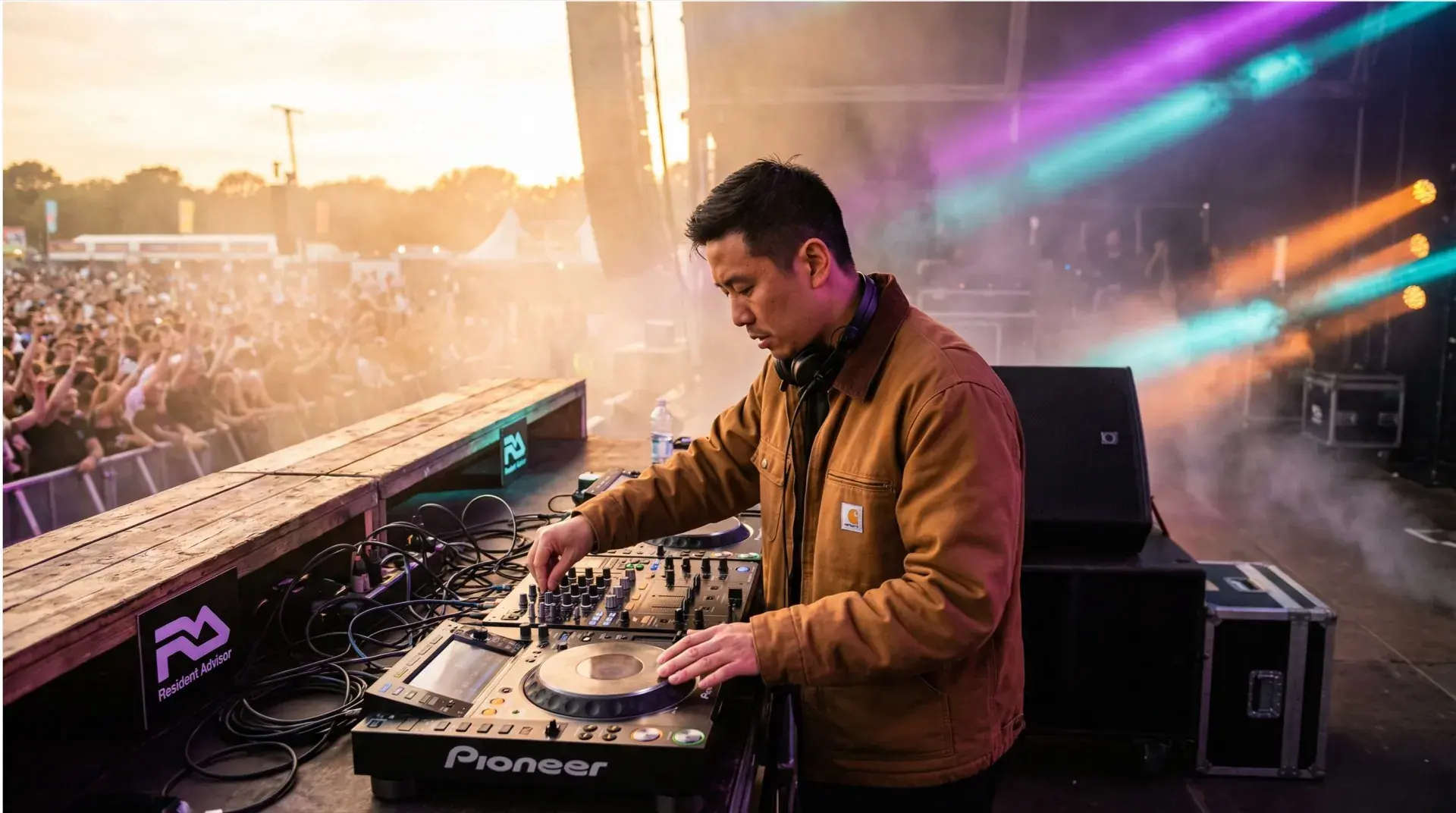 Professional DJ performing at a live venue with club lighting
