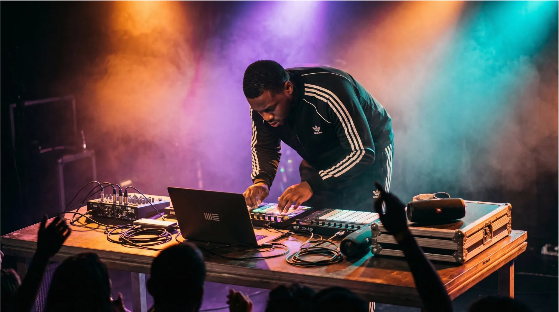 Drum and bass producer performing a live laptop set